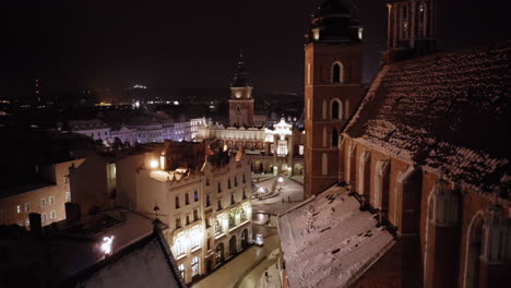 Winter-in-Krakow,-Poland---Aerial-view-of-Main-Market-Square,-Sukiennice,-St