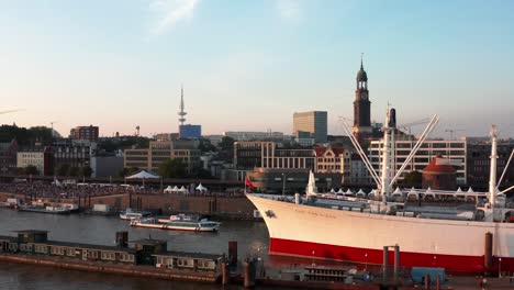 hamburg harbour boat cap san diego in sunset with hamburg michel in background at landungsbrücken cruise days