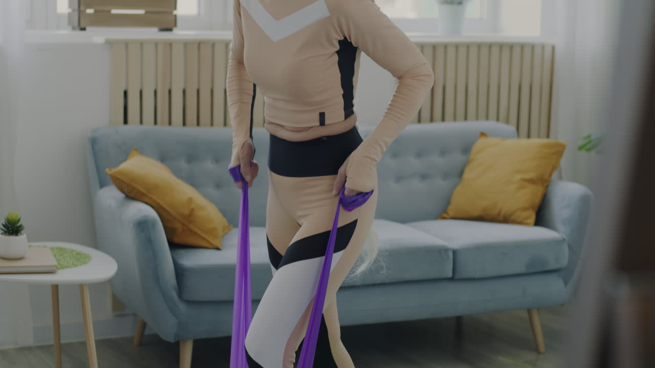 Senior Woman Exercising with Resistance Bands at Home