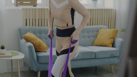 senior woman exercising with resistance bands at home