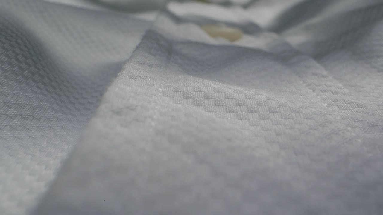 Closeup of an expertly tailored suit that beautifully showcases its sophisticated buttons and fine fabric texture