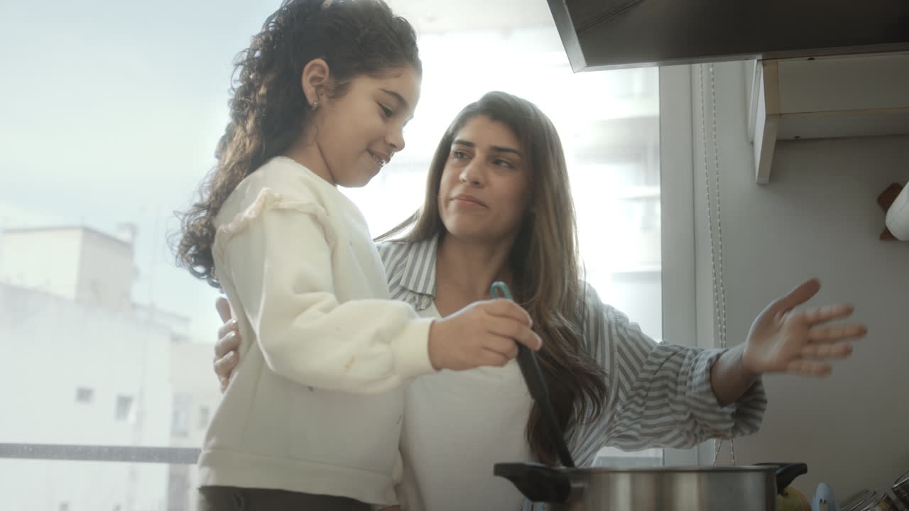 Little Girl Learning Cooking with Mom at Home