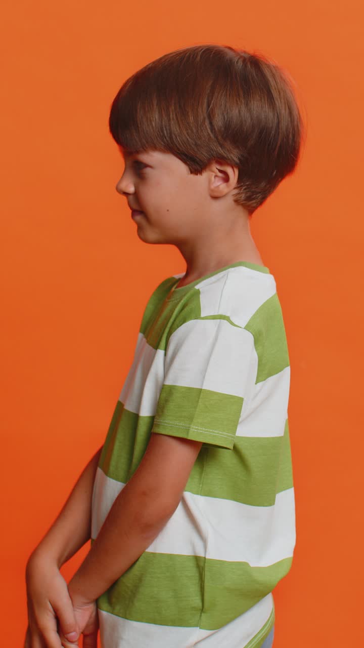 Happy preteen child boy kid smiling looking at camera dreaming resting good news feel satisfied