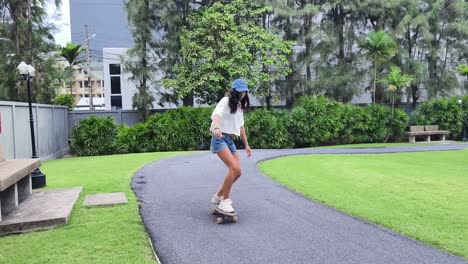 woman skateboarding in a park