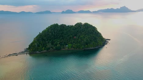 Aerial-of-island-off-Las-cabanas-beach-at-sunset