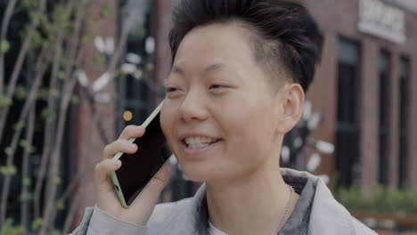 young woman talking on the phone in the city