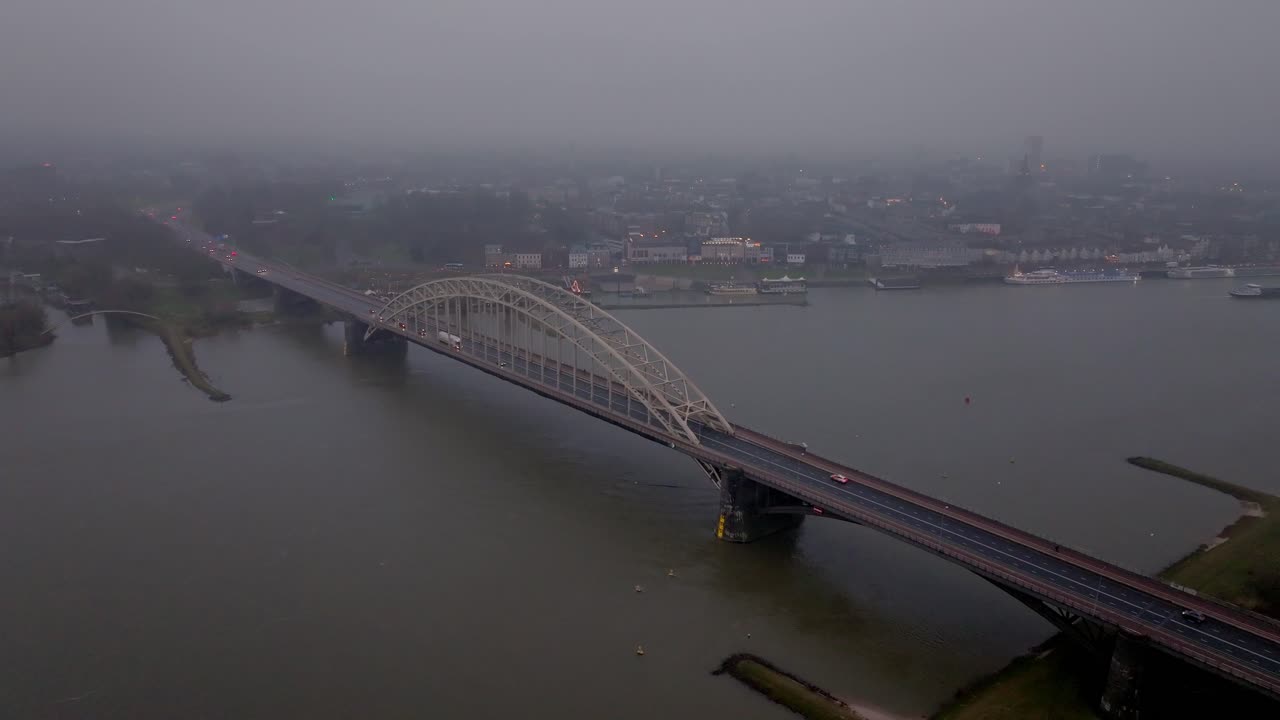 Wide Drone shot of Moring traffic on the Waal bridge of Nijmegen