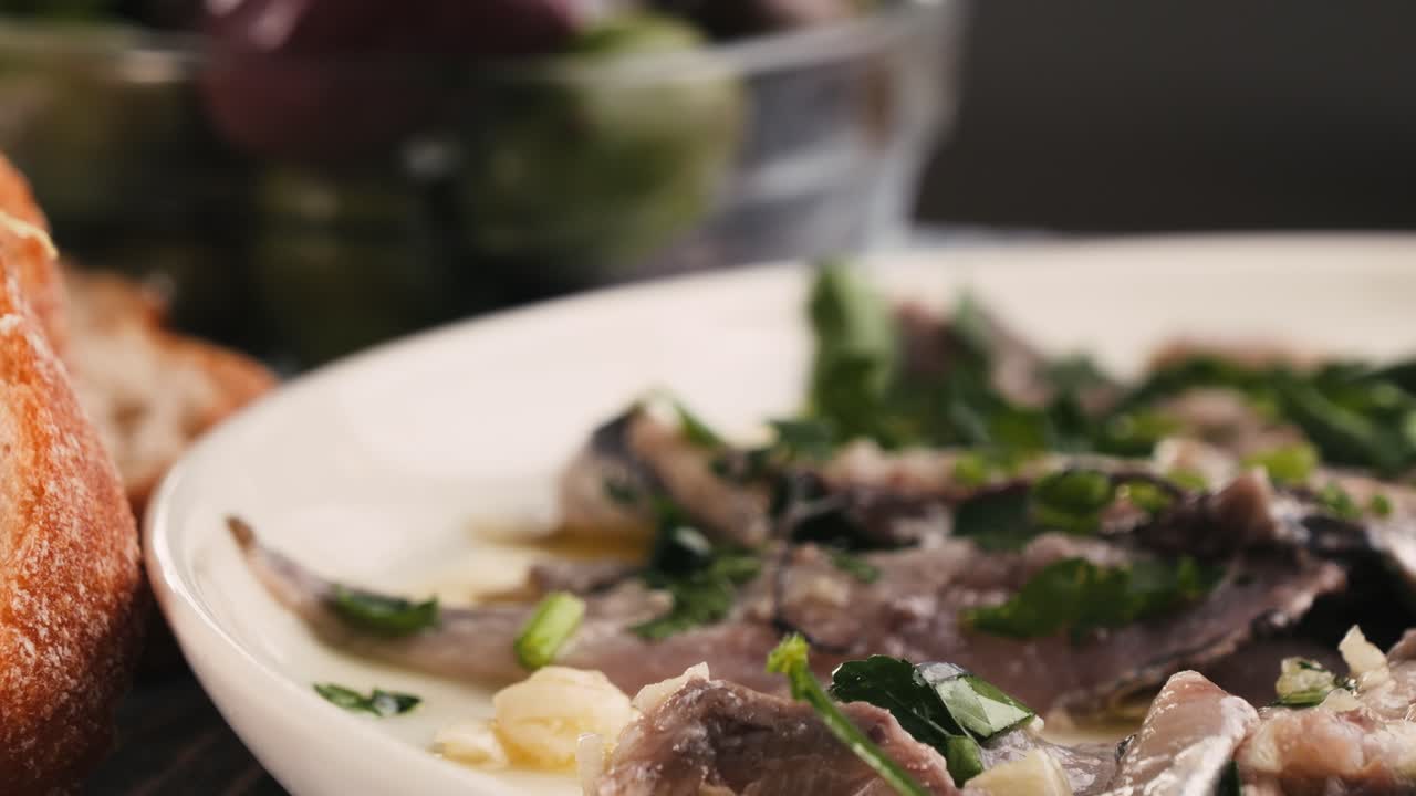 Fresh Sea sardines and Anchovy Fish and Mullus On Display On Ice On Market Store Shop. Seafood Fish Background, close up stand of small salty white fish.