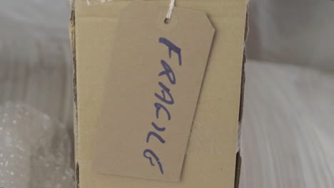 box marked as fragile with tag