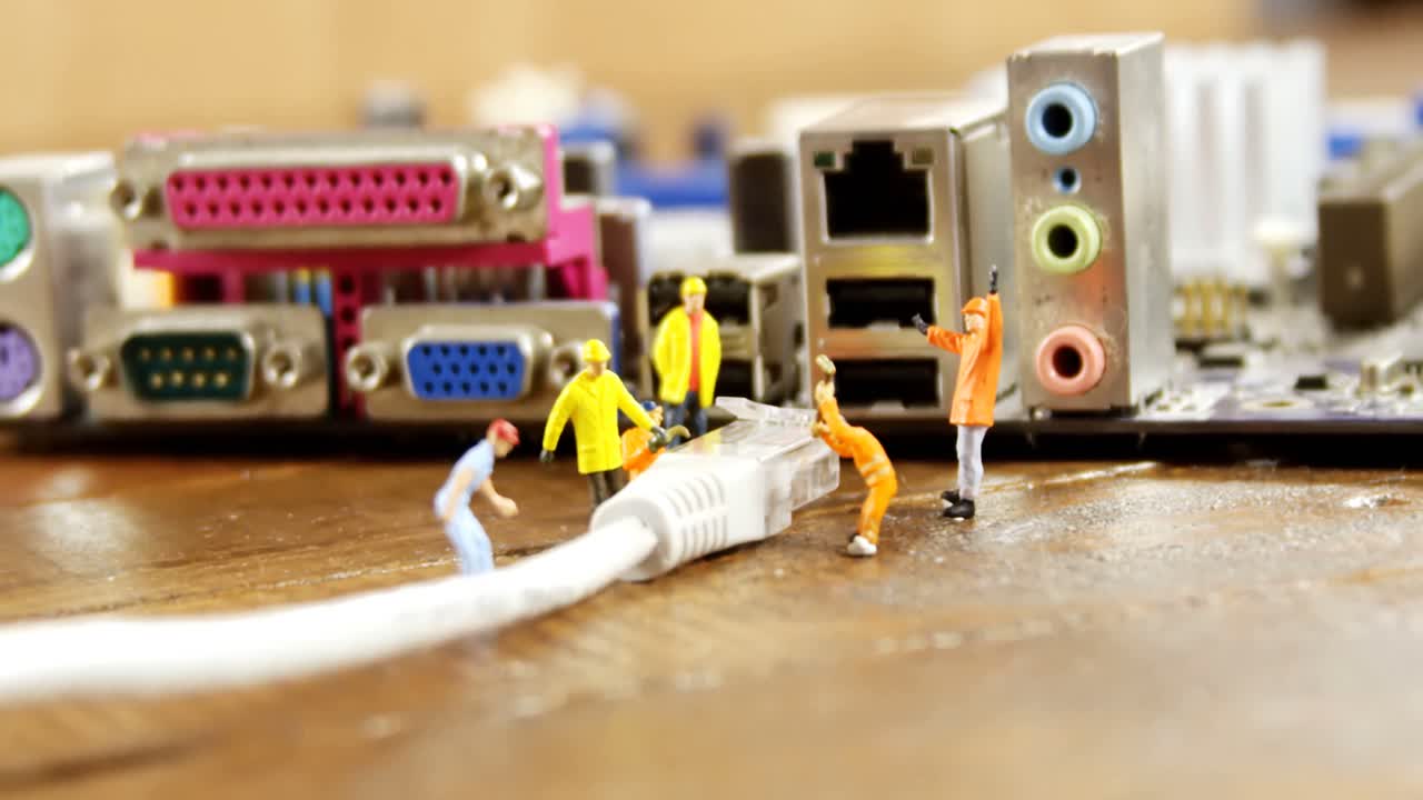 Close-up of figurine with cable and computer socket