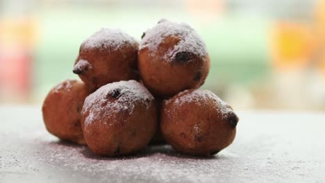 yummy homemade small dutch oil balls delicacy with sugar powder traditionally eaten on new year's eve in the netherlands