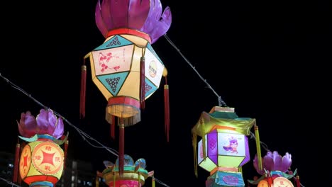 chinese lanterns, which symbolize prosperity and good fortune, hang from ceiling wires during the mid-autumn festival, also called mooncake festival