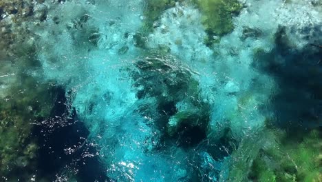 bubbling turquoise water in the spring of blue eye nature monument, near to saranda, albania