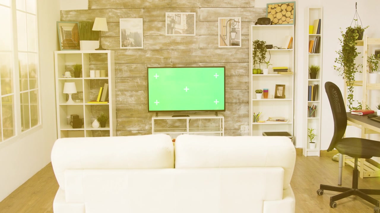 Modern Living Room Interior with Green Screen Television
