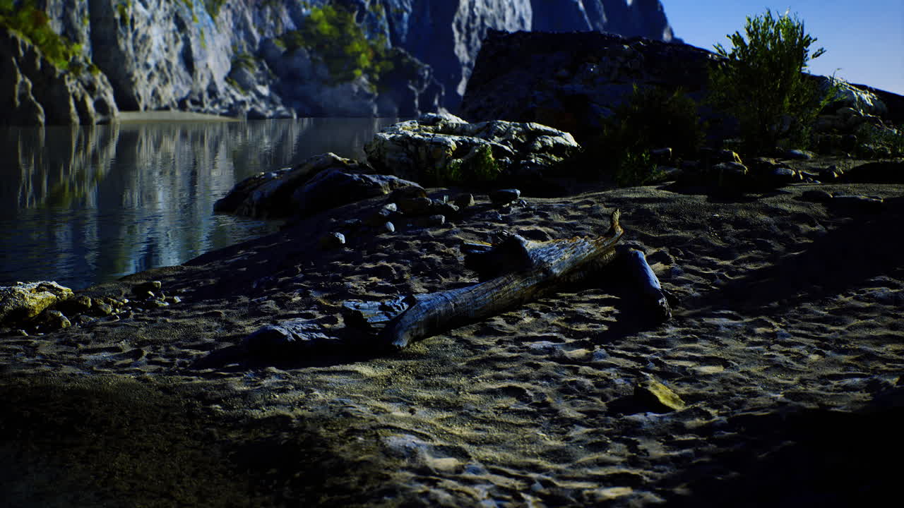 Scenic riverside view showcasing a log resting on sandy shore at dusk