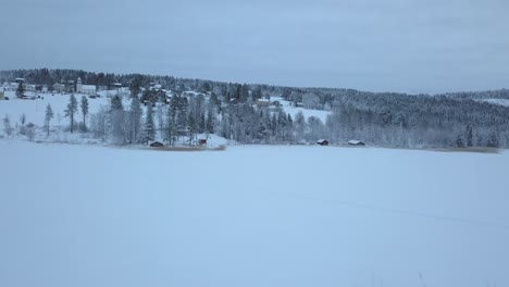 The-frozen-lake-and-forest-near-Borgvattnet,-Sweden