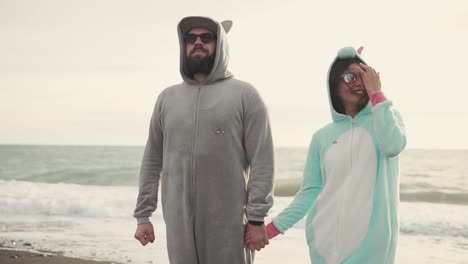 couple in pajamas on the beach