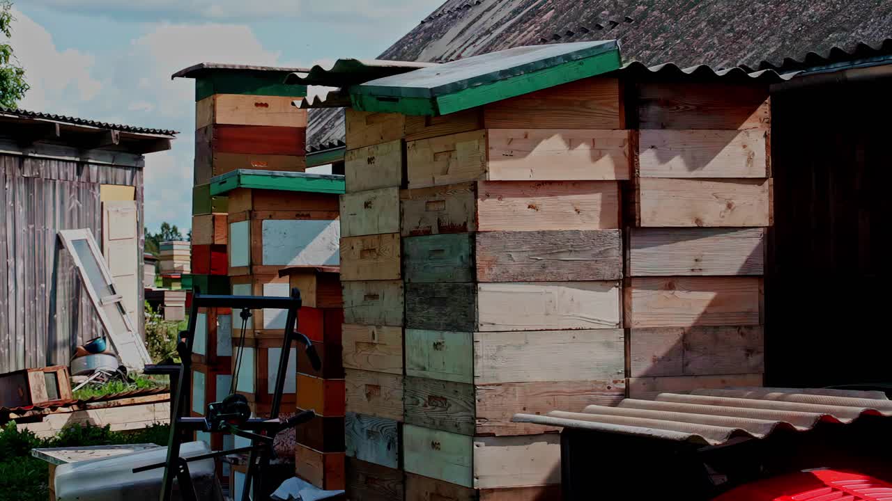 Apiculture structures designed to house honeybee colonies stacked wooden boxes