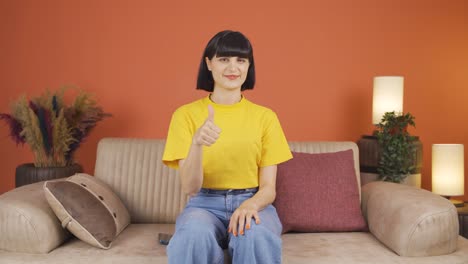 woman making positive gesture at camera.