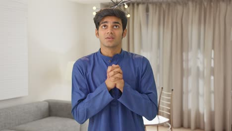Scared-Indian-man-praying-to-God