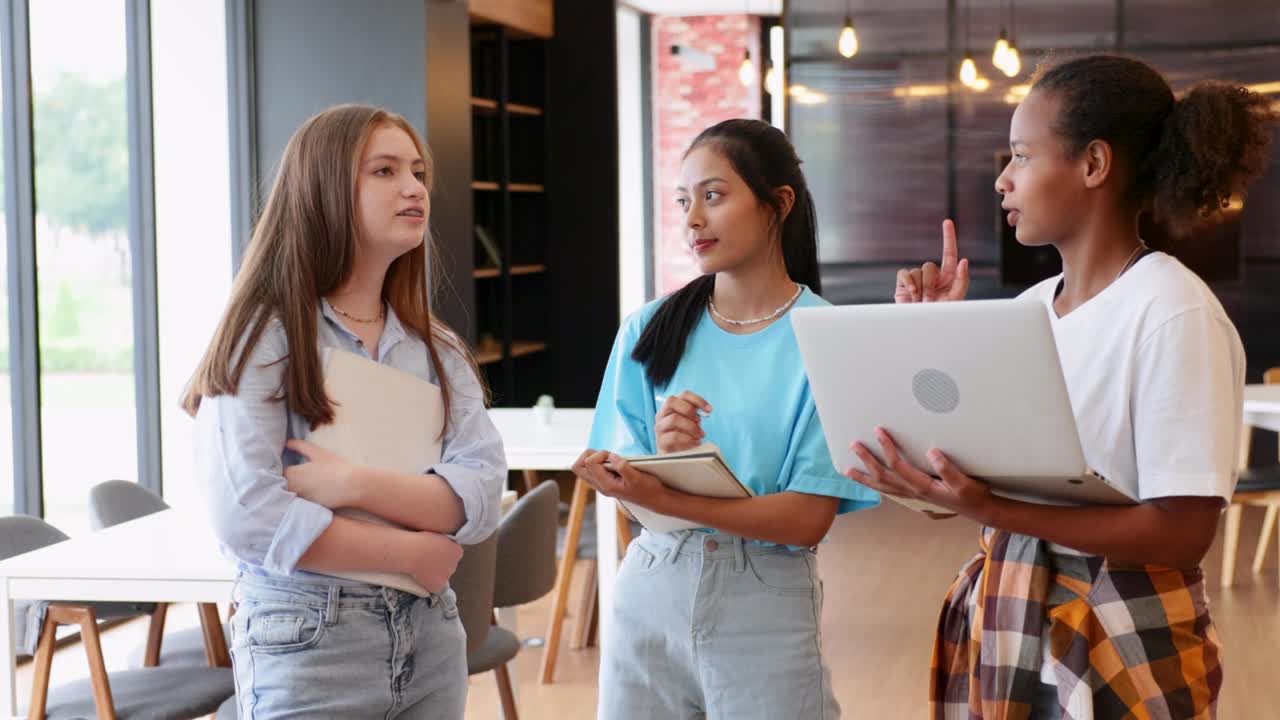 Group of teenager student walking to leaning in library of school. University Library education and Student Learning concept.