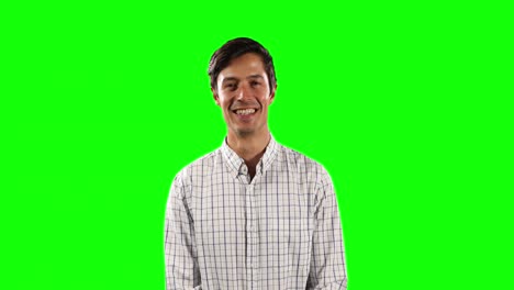 Front-view-of-Caucasian-man-looking-at-camera-with-green-screen