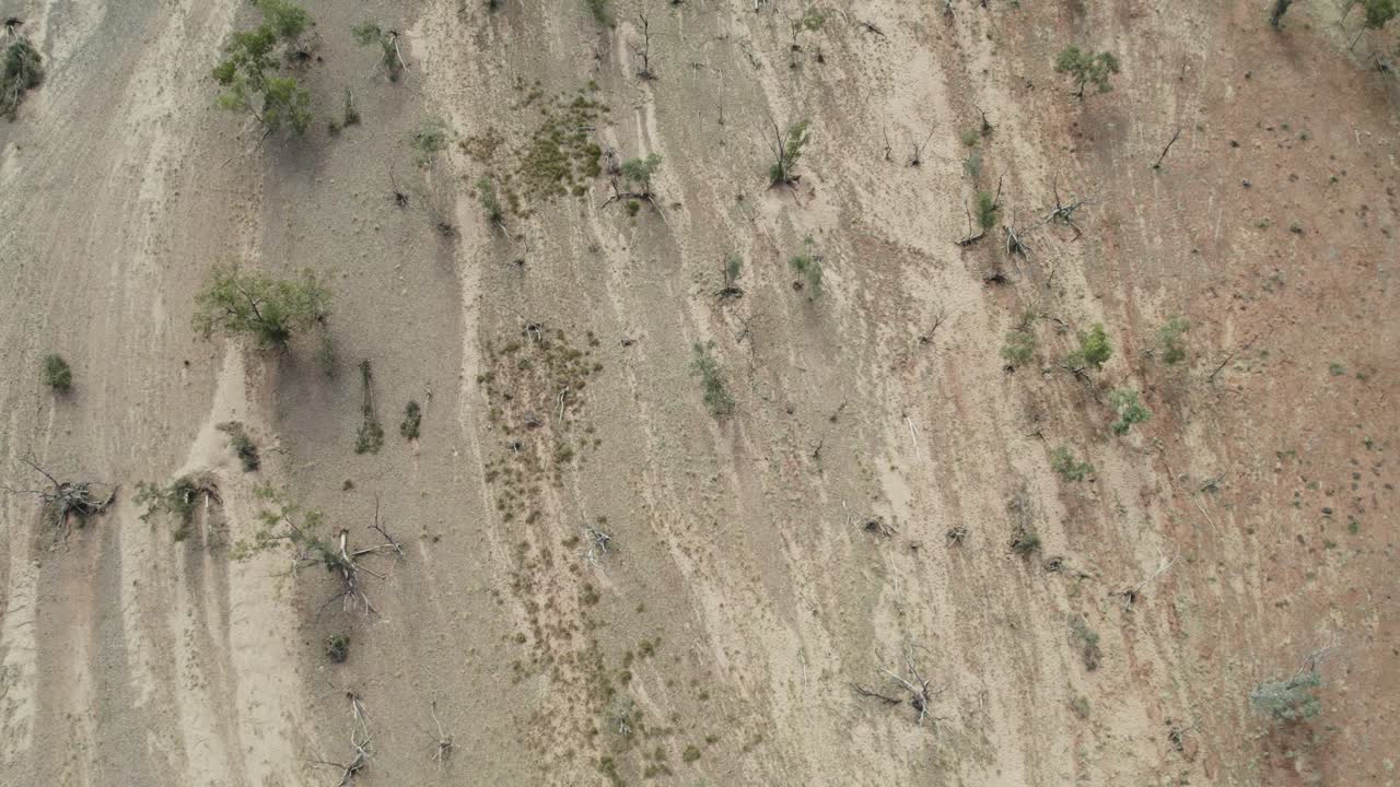 Drone view looking straight down on the dry Hugh River near the Stuart Highway in the Northern Territory, Australia. August 2022.