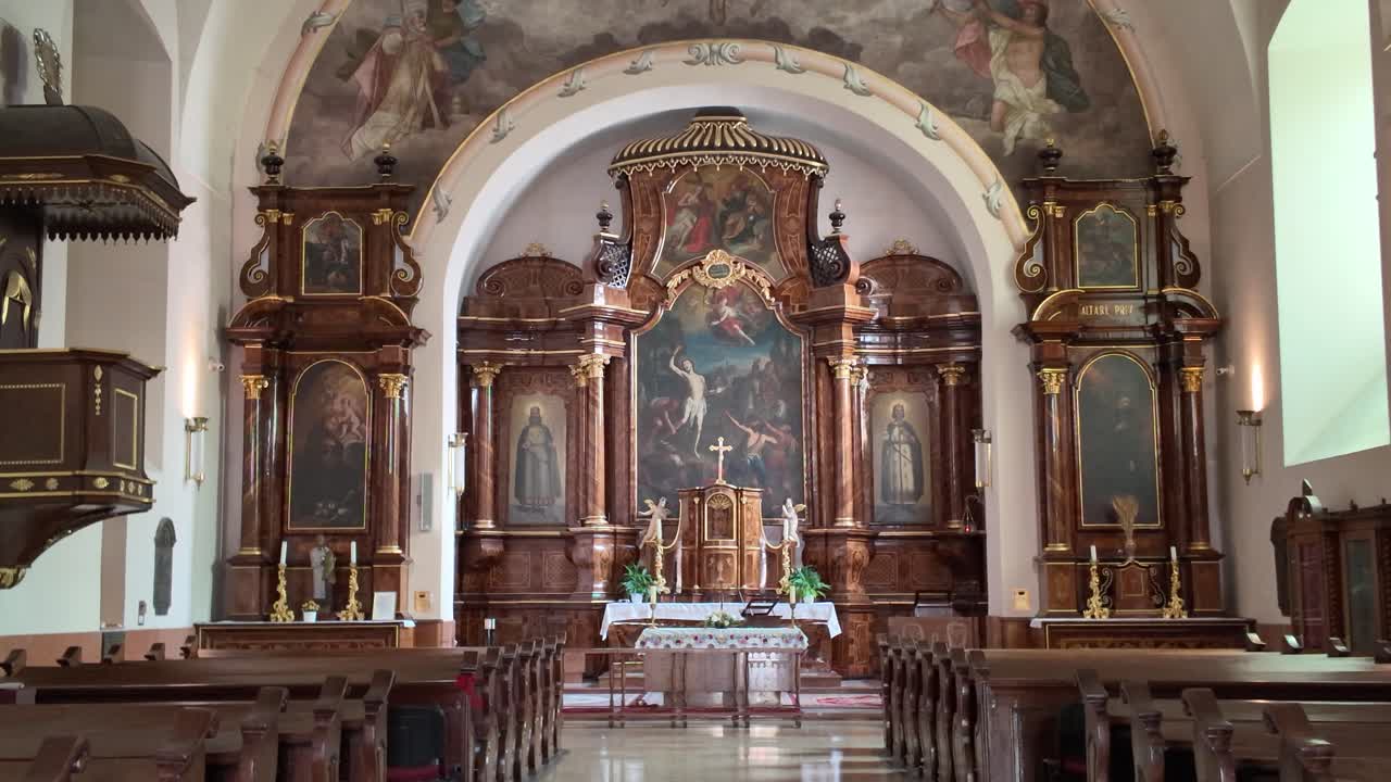 Interior view of Saint Sebastian’s Church in Pécs, highlighting the ornate altar and intricate historic architectural details
