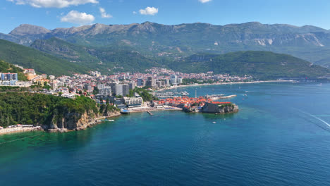 aerial: out on the sea in front of the city of budva, summer day in montenegro