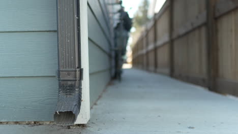 drainage pipe beside a side path to a house