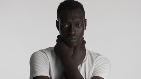 Burdened African american man on grey background.