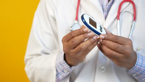 doctor holding a glucose meter