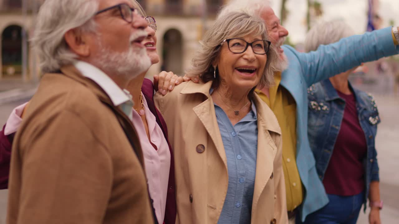 A group of older people smiling and enjoying their time outdoors