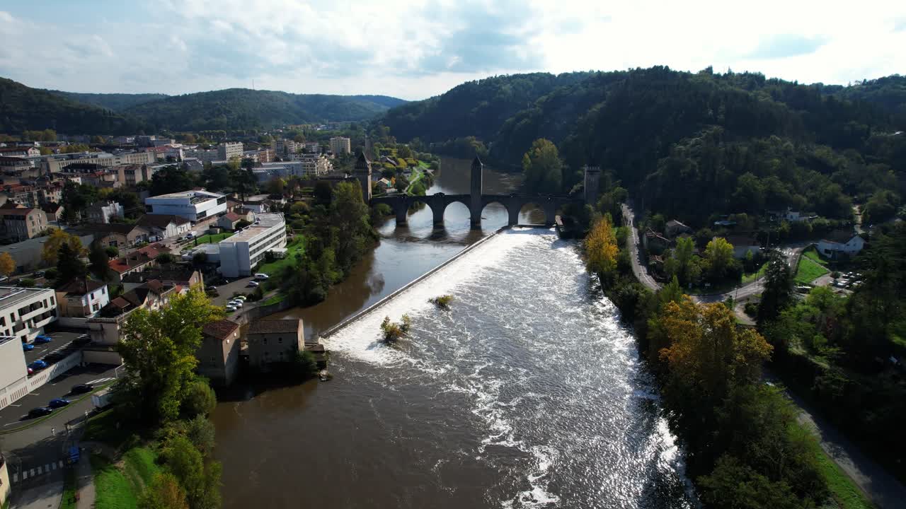 The Lot River winding through Cahors, France, with scenic limestone cliffs