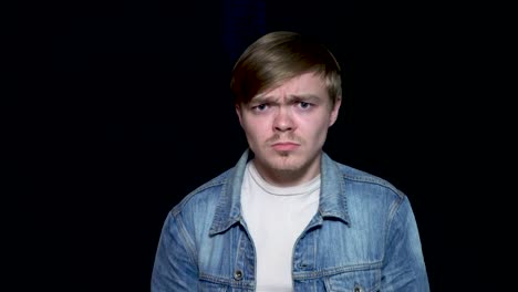 close-up portrait of a man with a confused expression