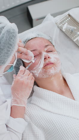 cosmetologist making young woman beauty antiaging injections biorevitalization face eye mesotherapy