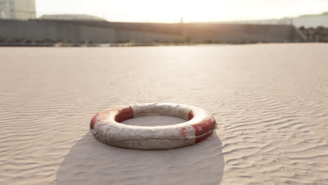 life preserver on a sandy beach