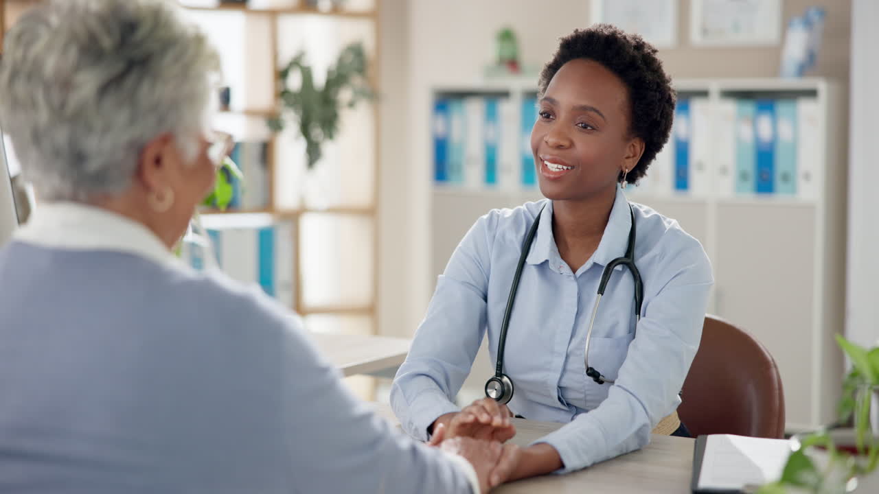 Doctor consulting with elderly patient