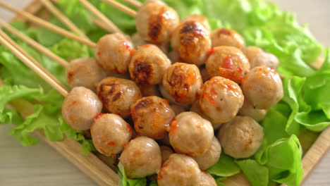 grilled meatballs skewer with spicy dipping sauce