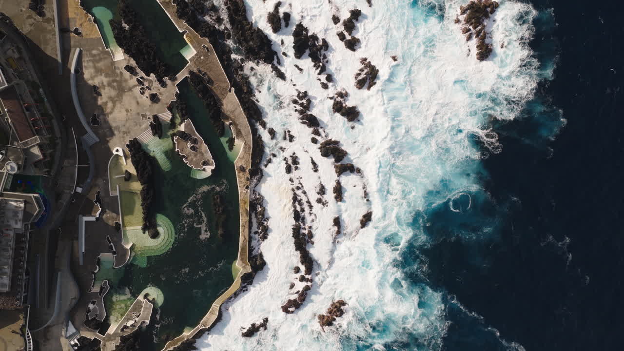 Aerial View of Natural Volcanic Pools and Crashing Ocean Waves