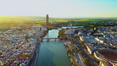 drone flying straight toward the skyline over the guadalquivir river, seville spain 4k 23fps