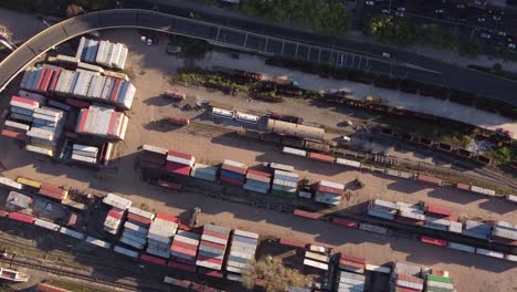 aerial top down shot of industrial containers at port harbor of buenos aires during sunset