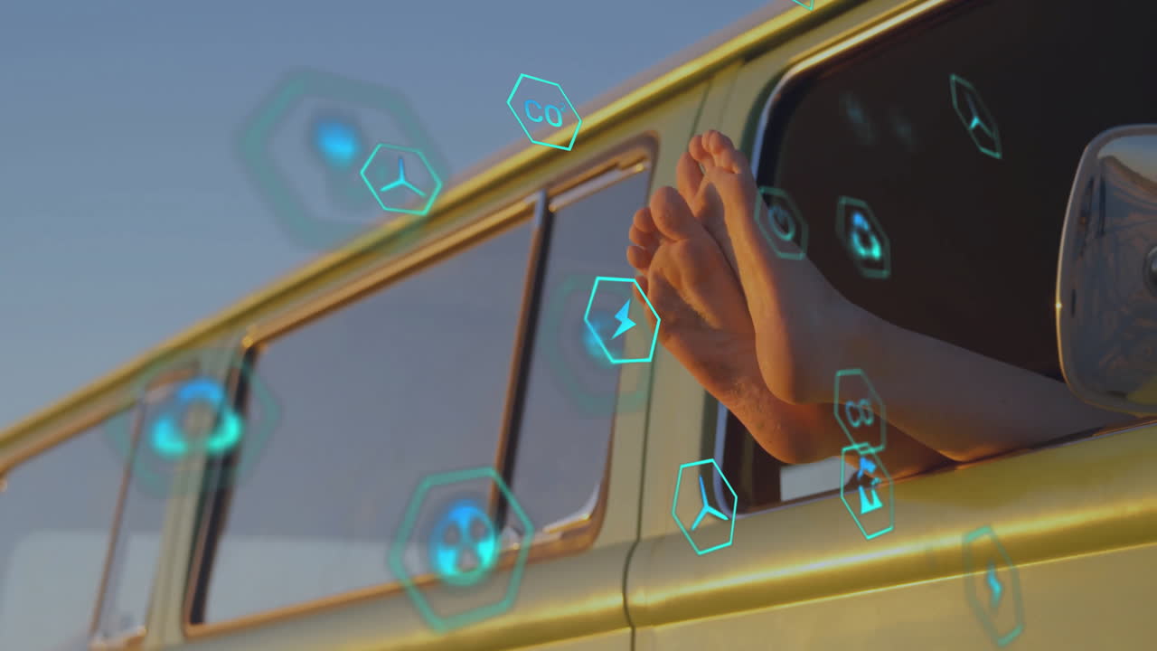 Feet sticking out of car window with animation of floating digital icons