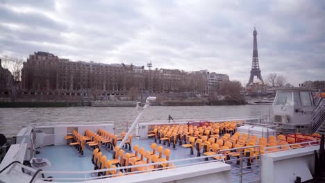 empty tourist river boats in paris during lockdown during the covid-19 pandemic, with view of the eiffel tower, tourism in france