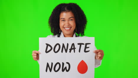 Woman,-doctor-and-blood-donation-sign-on-green