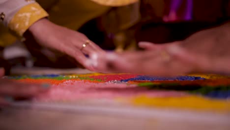 A-sheet-of-colorful-wedding-rice-is-assembled-and-organized-by-four-different-women