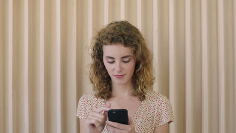 portrait-of-beautiful-young-red-head-woman-enjoying-texting-browsing-using-smartphone-mobile-technology