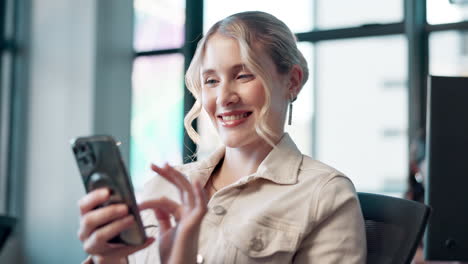 a woman using her phone in the office