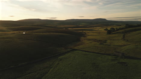 Establishing-Drone-Shot-Over-Hills-of-Yorkshire-Dales-at-Golden-Hour