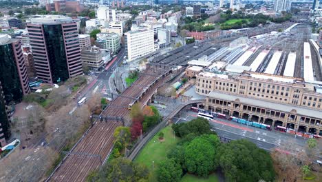 landscape view of train and tram in central station main street town buildings city of sydney haymarket surry hills travel transport architecture